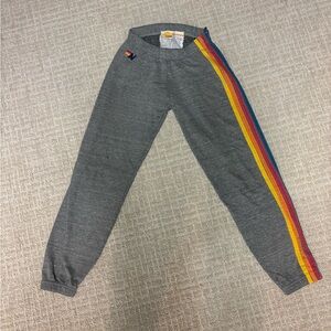 Gray Aviator Nation sweatpants with Rainbow Stripe